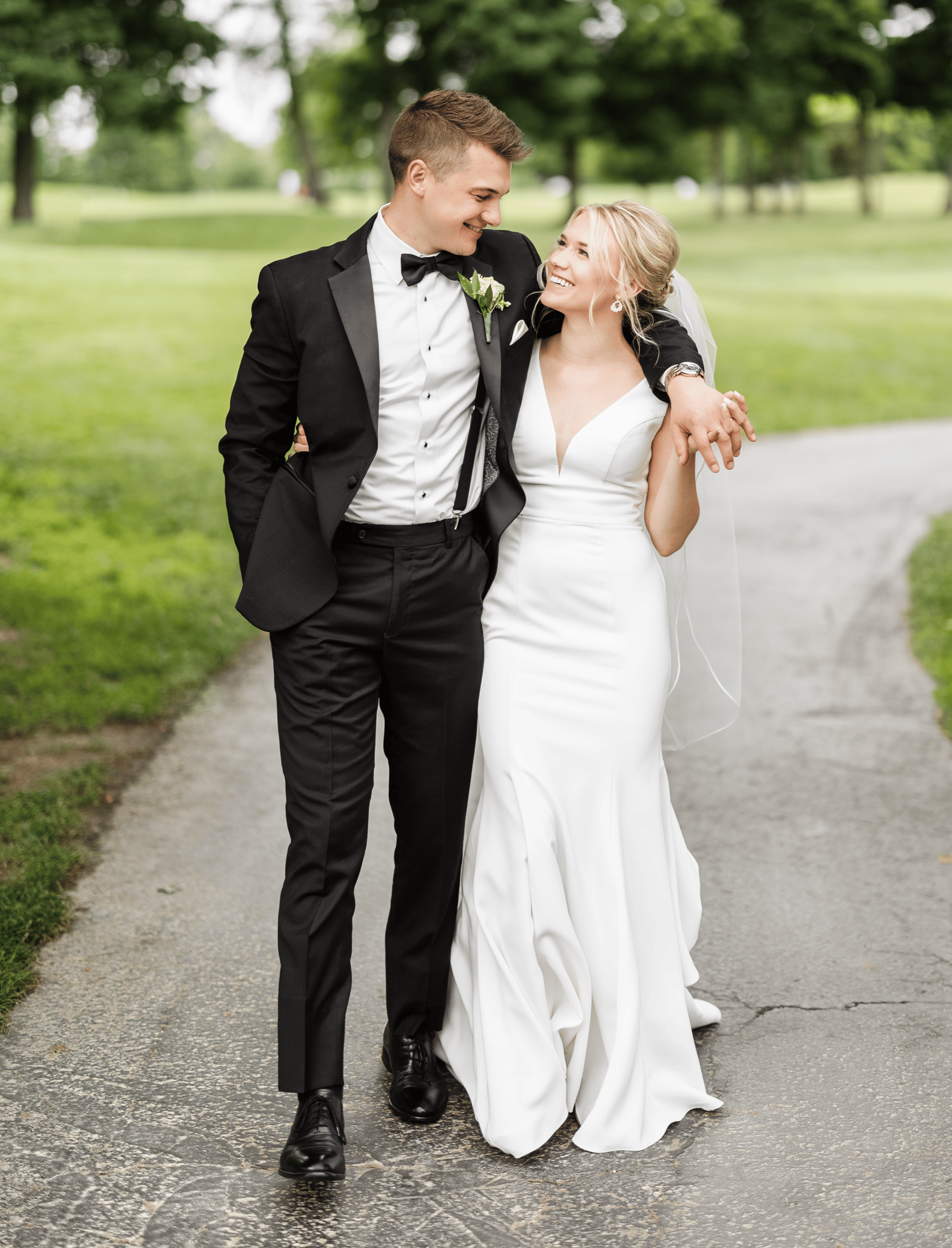 Couple-walking-down-concrete-path