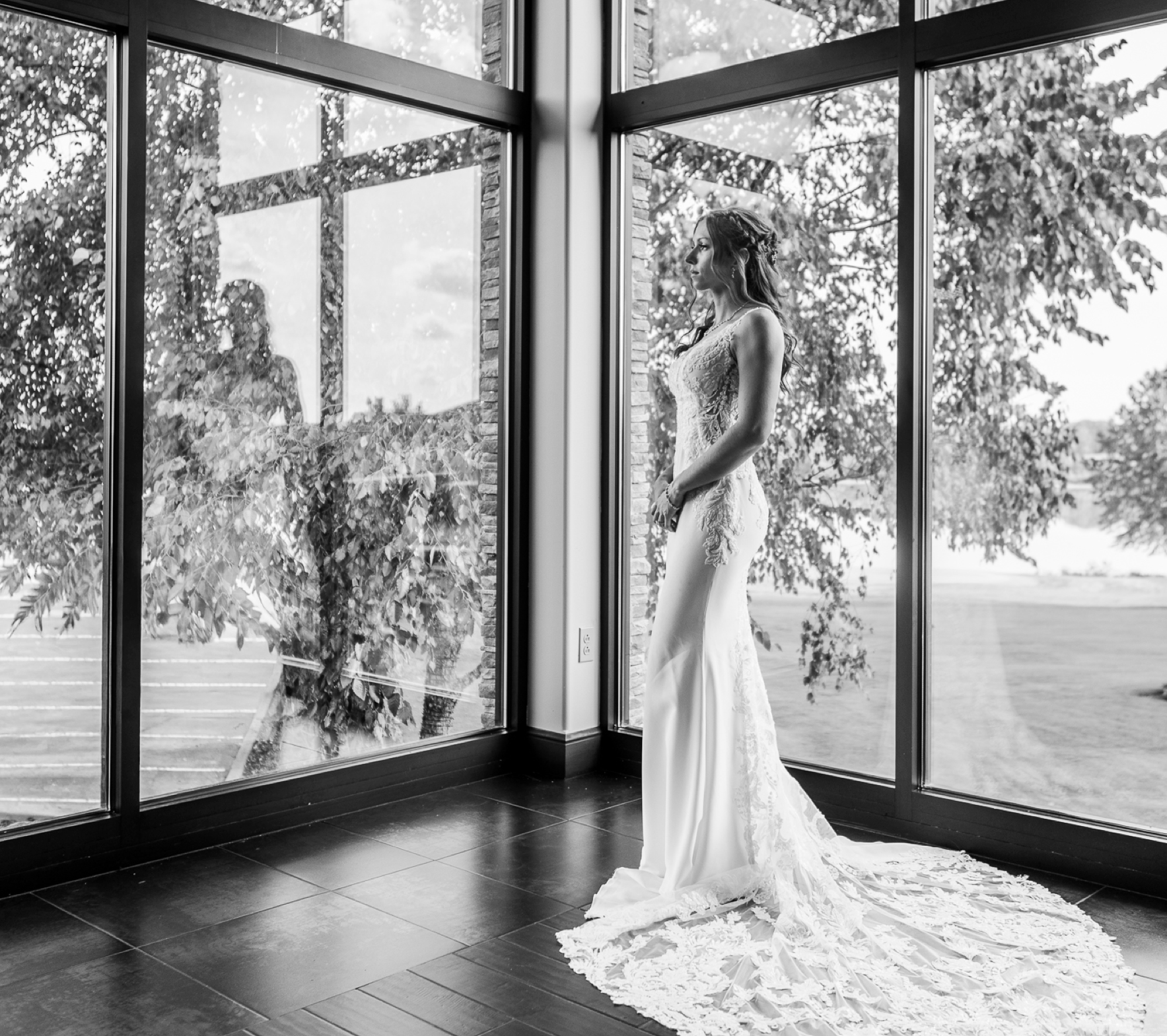 bride-overlooks-lake-on-wedding-day